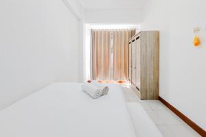 Modern Look 1BR Apartment at Scientia Residence By Travelio