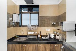 Earthy 1BHK Bandra W by The Bombay Home Company