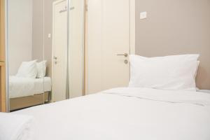 Nice and Modern 2BR at Green Pramuka City Apartment By Travelio