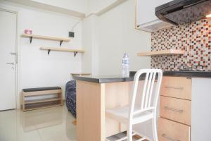 Nice and Modern 2BR at Green Pramuka City Apartment By Travelio