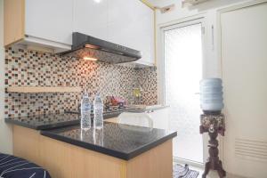 Nice and Modern 2BR at Green Pramuka City Apartment By Travelio