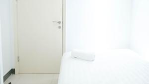 Spacey and Homey 2BR at Supermall Mansion Apartment By Travelio