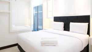 Spacey and Homey 2BR at Supermall Mansion Apartment By Travelio