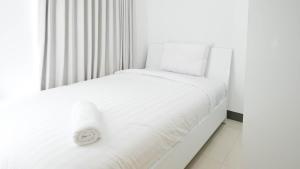 Spacey and Homey 2BR at Supermall Mansion Apartment By Travelio