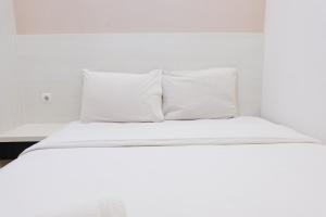 Homey and Cozy 2BR Apartment at Parahyangan Residence By Travelio