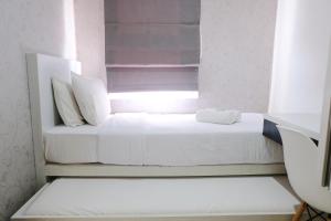 Homey and Cozy 2BR Apartment at Parahyangan Residence By Travelio