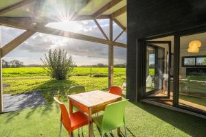 Maisons de vacances Kergueguen - Charmante maison avec jardin : photos des chambres
