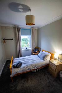 Spacious 4-Bedroom House in Glenboig