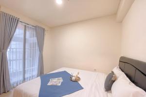 Modern 2BR Room at Meikarta Apartment By Travelio
