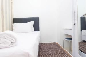 Cozy and Best Deal 2BR Bassura City Apartment By Travelio