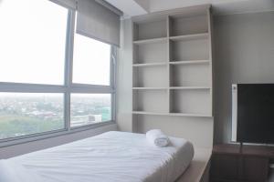 Warm and Cozy Studio at Springlake Summarecon Apartment By Travelio