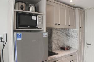 Warm and Cozy Studio at Springlake Summarecon Apartment By Travelio