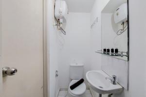 Cozy and Minimalist Studio (No Kitchen) at Aeropolis Apartment By Travelio