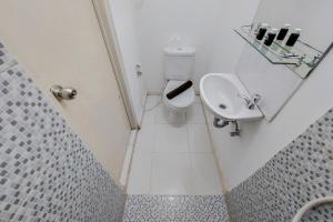 Cozy and Minimalist Studio (No Kitchen) at Aeropolis Apartment By Travelio