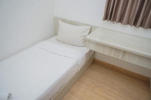 Comfort and Minimalist 2BR at Sky House BSD Apartment By Travelio