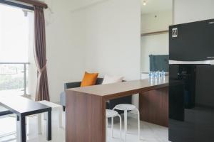 Comfort and Minimalist 2BR at Sky House BSD Apartment By Travelio