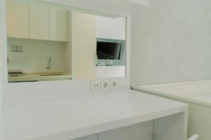 Minimalist and Homey Studio at Sky House BSD Apartment By Travelio