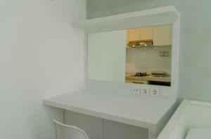 Minimalist and Homey Studio at Sky House BSD Apartment By Travelio