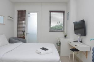 Stunning and Comfy Studio Signature Park Grande Apartment By Travelio