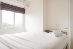 Comfort Living and Minimalist 1BR at Bassura City Apartment By Travelio