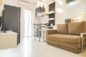Comfort Living and Minimalist 1BR at Bassura City Apartment By Travelio
