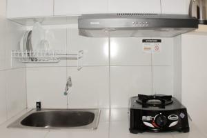 Comfy and Tidy Studio at Riverview Jababeka Apartment By Travelio