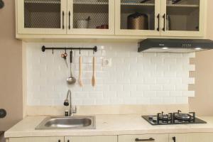 New and Cozy Studio at Patraland Urbano Apartment By Travelio