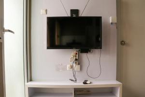 Homey and Cozy Stay 2BR at Green Pramuka City Apartment By Travelio