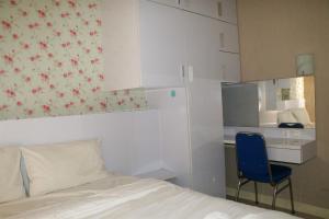 Homey and Cozy Stay 2BR at Green Pramuka City Apartment By Travelio