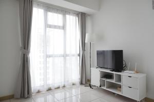 Elegant 1BR Apartment at M-Town Residence near Summarecon Mall By Travelio