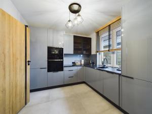 ApartamentySnu, Dom na Przedmieściu