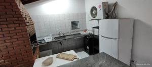 Casa piscina pé na areia Bertioga