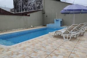 Casa piscina pé na areia Bertioga