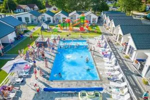 Comfortable holiday homes with swimming pool - Dąbki