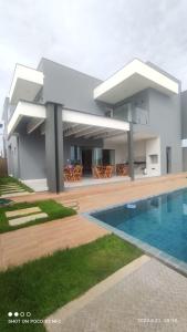 Excelente casa de praia 4 suítes em condomínio