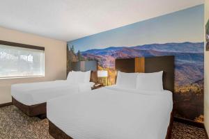 Studio with Two Queen Beds and Sofa Bed room in MainStay Suites Conference Center Pigeon Forge