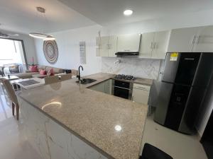 Front beach apartment close to the Cartagena letters