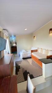 Chalé com ar condicionado e garagem