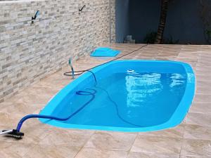 Casa aconchegante com churrasqueira e piscina para um ambiente familiar