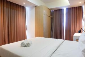 3BR Luxurious and Elegant Apartment at Grand Sungkono Lagoon By Travelio