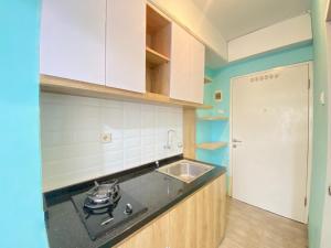 Modern and Comfy Studio Room at Grand Asia Afrika Apartment By Travelio