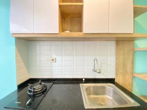 Modern and Comfy Studio Room at Grand Asia Afrika Apartment By Travelio