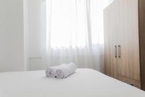 Brand New and Homey 2BR Meikarta Apartment By Travelio