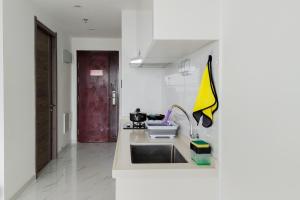 Elegant and Strategic 2BR Sky House BSD Apartment By Travelio