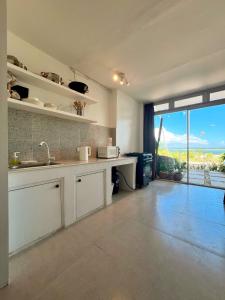 Beachfront Apartment with Kitchen and Outdoor Seating Area