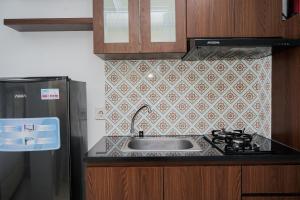 Comfort and Warm Studio Room Apartment at M-Town Residence By Travelio