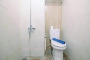 Cozy and Minimalist Studio Apartment at Grand Dhika City By Travelio