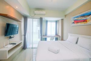 Cozy and Minimalist Studio Apartment at Grand Dhika City By Travelio