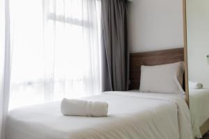 Modern and Clean 2BR Apartment at M-Town Residence By Travelio