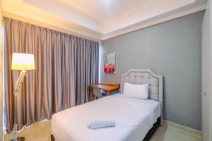 Comfy and Cozy 2BR at Menteng Park Apartment By Travelio